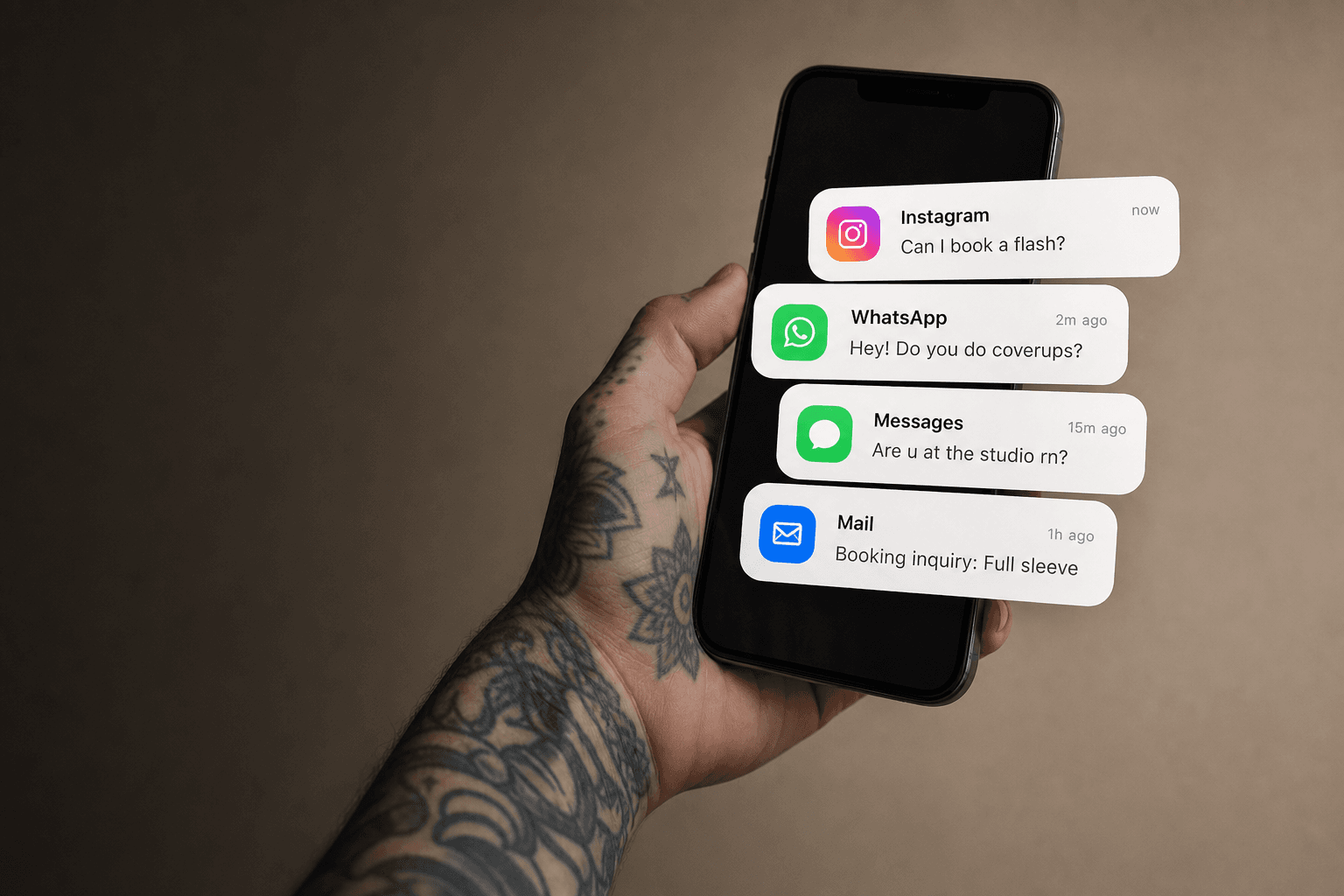 Tattoo artist holding phone with notifications